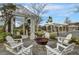 Inviting outdoor firepit area with comfortable Adirondack chairs for gathering and relaxation at 1226 Spotflower St, Summerville, SC 29485