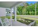 Inviting front porch with comfortable seating and views of the landscaped yard and quiet street at 1226 Spotflower St, Summerville, SC 29485