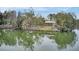 Picturesque lake with a charming wooden bridge and covered picnic area, reflecting the serene waters at 1226 Spotflower St, Summerville, SC 29485