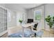 Well-lit office space with French doors, a white desk, and a comfortable executive chair at 1226 Spotflower St, Summerville, SC 29485