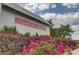 Sign of Summers Corner community with landscaped bushes and pink flowers in front at 1226 Spotflower St, Summerville, SC 29485