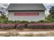 Entrance sign of Summers Corner community with landscaped bushes and flowers at 1226 Spotflower St, Summerville, SC 29485