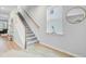 Staircase featuring wood and white accents, carpeted steps and a window with natural light at 1226 Spotflower St, Summerville, SC 29485