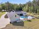 Aerial view of the property highlighting the pool, expansive yard, and surrounding landscape at 1245 Saddlehorn Rd, Summerville, SC 29486