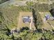 Overhead view of a property featuring a home, pool, outbuilding, and a long driveway at 1245 Saddlehorn Rd, Summerville, SC 29486
