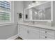 Bright bathroom featuring white cabinetry, modern lighting, and sleek fixtures at 1245 Saddlehorn Rd, Summerville, SC 29486