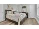 Serene bedroom featuring a dark wood frame bed, soft decor, and modern fixtures at 1245 Saddlehorn Rd, Summerville, SC 29486