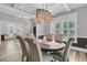 A well-lit dining room with beautiful decor, featuring a view into another room and large windows at 1245 Saddlehorn Rd, Summerville, SC 29486