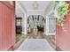Inviting foyer with hardwood floors, decorative lighting, and an open view of the living spaces at 1245 Saddlehorn Rd, Summerville, SC 29486