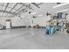 Spacious three car garage with ample storage and lighting at 1245 Saddlehorn Rd, Summerville, SC 29486