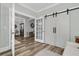 A spacious hallway showcases elegant doors, moldings, and flows into the dining room and living room at 1245 Saddlehorn Rd, Summerville, SC 29486