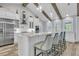 Bright kitchen featuring white cabinets, stainless steel appliances, an island, and wood-look flooring at 1245 Saddlehorn Rd, Summerville, SC 29486