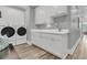 Well-equipped laundry room with a sink, plenty of storage, and modern appliances at 1245 Saddlehorn Rd, Summerville, SC 29486