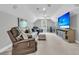 Spacious living room with comfortable seating, a large TV, and stylish decor at 1245 Saddlehorn Rd, Summerville, SC 29486