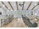 Open-concept living room with hardwood floors, exposed beams, and modern furniture at 1245 Saddlehorn Rd, Summerville, SC 29486