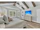 Airy bedroom with wood-look floors, vaulted ceilings, a ceiling fan, and a window with wooden shutters at 1245 Saddlehorn Rd, Summerville, SC 29486