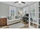 Bright office space with natural light, a cozy sofa, desk, and french doors at 1245 Saddlehorn Rd, Summerville, SC 29486