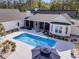 Aerial view of a private backyard with a sparkling pool and manicured landscaping at 1245 Saddlehorn Rd, Summerville, SC 29486