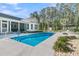 Beautiful backyard pool area with lush landscaping and ample space for relaxation at 1245 Saddlehorn Rd, Summerville, SC 29486