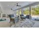 Spacious screened porch with lounge seating, offering views of the backyard pool at 1245 Saddlehorn Rd, Summerville, SC 29486