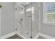 Modern shower with clear glass enclosure and decorative tiling at 1245 Saddlehorn Rd, Summerville, SC 29486