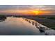 Drone view overlooking the waterway, docks and community at sunset at 13 Broughton Rd, Charleston, SC 29407