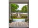 Tranquil backyard view of dock, pool, and waterway at 13 Broughton Rd, Charleston, SC 29407