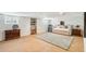 Finished basement provides ample living space, custom shelving, exposed brick, and cozy seating on a plush rug at 13 Broughton Rd, Charleston, SC 29407
