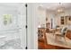 Luxurious bathroom with stylish tile floors, white fixtures, and a view into a bright living area at 13 Broughton Rd, Charleston, SC 29407