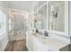 Beautiful bathroom features marble shower and vanity with blue accents at 13 Broughton Rd, Charleston, SC 29407