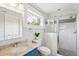 Bathroom featuring marble vanity, glass enclosed shower, and mosaic tile accents at 13 Broughton Rd, Charleston, SC 29407