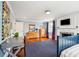Bedroom featuring hardwood floors, fireplace, blue rug and good light at 13 Broughton Rd, Charleston, SC 29407