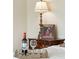 Bedroom decor featuring a decorative tray with wine and glasses, complemented by a framed photo and lamp at 13 Broughton Rd, Charleston, SC 29407