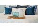 Bedroom detail of styled bed with glass and pitcher at 13 Broughton Rd, Charleston, SC 29407