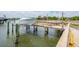 Boat lift featuring a powerboat on the lift, and an adjacent walkway at 13 Broughton Rd, Charleston, SC 29407
