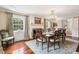 Elegant dining room featuring a fireplace, chandelier, and ornate wood table with seating for six at 13 Broughton Rd, Charleston, SC 29407