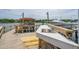 Dock with a sink, boat lift, covered structure, and a powerboat in the background at 13 Broughton Rd, Charleston, SC 29407