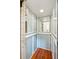 Home elevator with wood paneling, mirror, and classic control panel at 13 Broughton Rd, Charleston, SC 29407