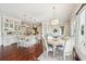Bright, open kitchen with large island, pendant lighting, and dining area at 13 Broughton Rd, Charleston, SC 29407