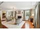 Bright living room with hardwood floors, fireplace, chandelier, and elegant furnishings at 13 Broughton Rd, Charleston, SC 29407