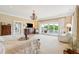 Spacious main bedroom with a chandelier, balcony access, neutral decor, and elegant furniture at 13 Broughton Rd, Charleston, SC 29407