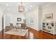 Bright and airy office space with hardwood floors, a decorative chandelier, and ample natural light at 13 Broughton Rd, Charleston, SC 29407