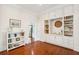 Office nook with custom built-ins, hardwood floors, and a decorative chandelier at 13 Broughton Rd, Charleston, SC 29407