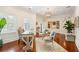 Stylish office with built-in shelving, hardwood floors, and a decorative chandelier at 13 Broughton Rd, Charleston, SC 29407