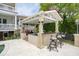 Covered outdoor kitchen with bar and grill at 13 Broughton Rd, Charleston, SC 29407
