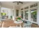Charming porch area with outdoor seating, perfect for enjoying the surrounding views at 13 Broughton Rd, Charleston, SC 29407