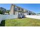 Enclosed backyard area with a white fence, and outdoor grill, and lawn at 132 Lynches River Dr, Summerville, SC 29485