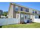 Cozy townhouse features a private, fenced backyard with a door leading inside at 132 Lynches River Dr, Summerville, SC 29485