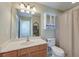 Bathroom featuring a vanity, mirror, and shower-tub combo with beige curtain at 132 Lynches River Dr, Summerville, SC 29485