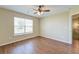 Inviting bedroom featuring hardwood flooring, a ceiling fan, and a sunny window at 132 Lynches River Dr, Summerville, SC 29485